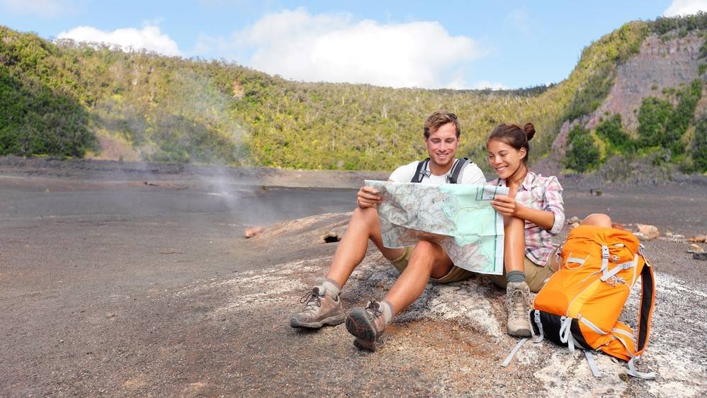 Couple hiking on volcano on Hawaii